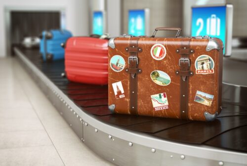 Old vintage suitcase on a airport luggage conveyor 2021 08 26 16 57 05 utc 1